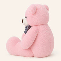 Grand ours en peluche rose vue de profil