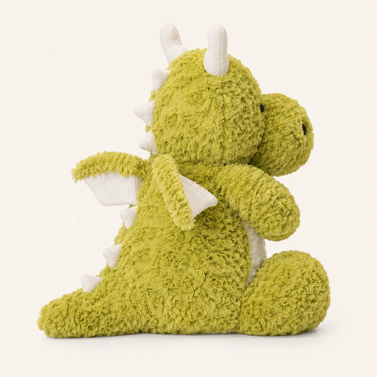 Peluche dragon vert vue de profil