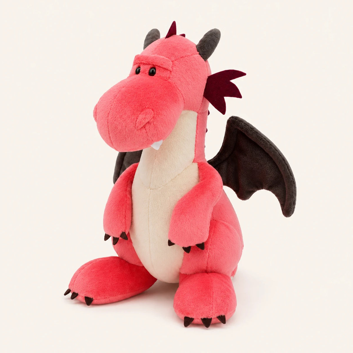 Peluche dragon rose corail vue de trois quarts