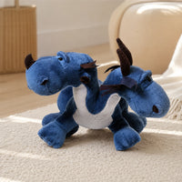 Peluche dragon bleu a deux tetes en situation dans un interieur