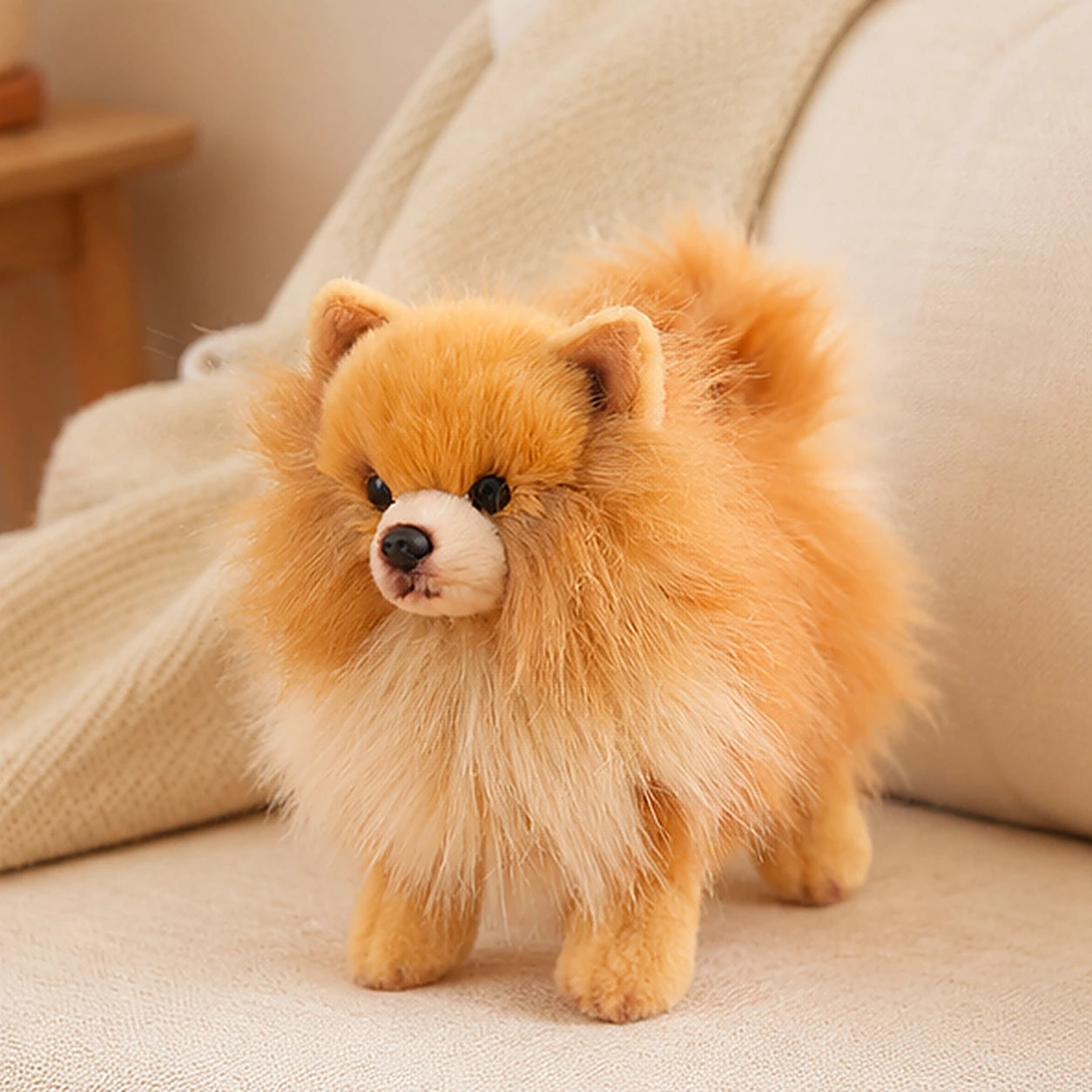 Peluche chien Pomeranien en situation sur canape