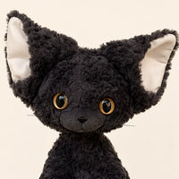 Peluche chat noir boucle gros plan visage