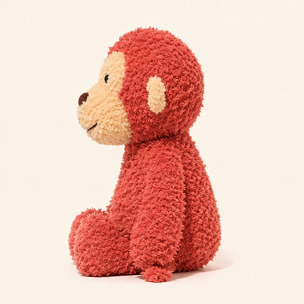 Peluche singe rouge vue de profil