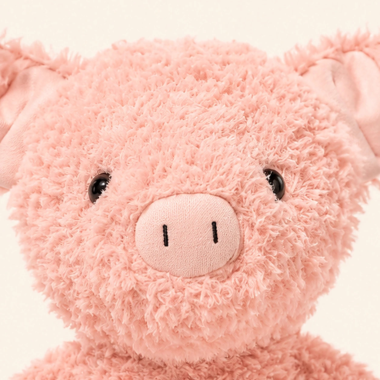 Peluche cochon rose gros plan visage
