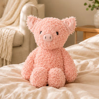 Peluche cochon rose en situation