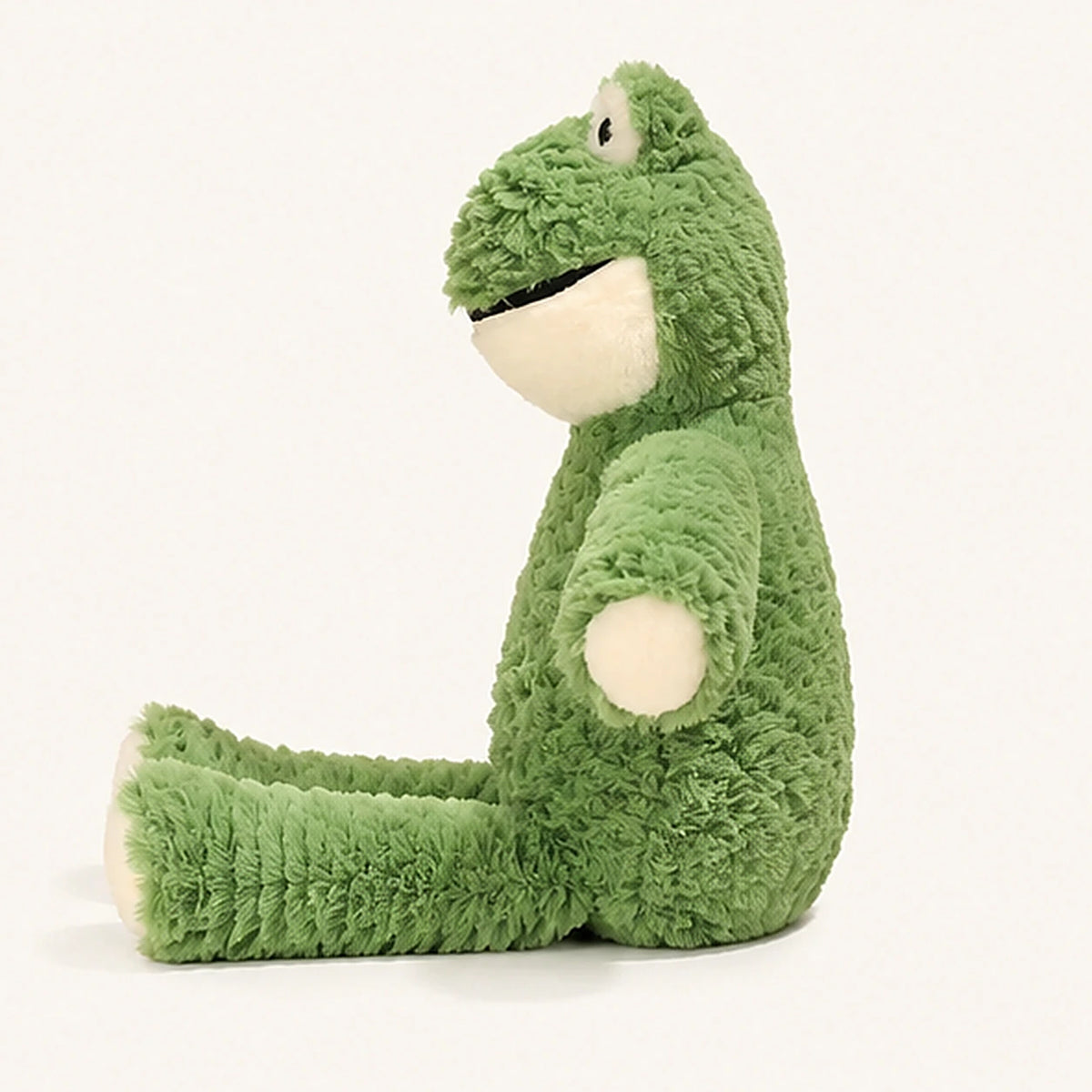 grenouille en peluche verte vue de profil