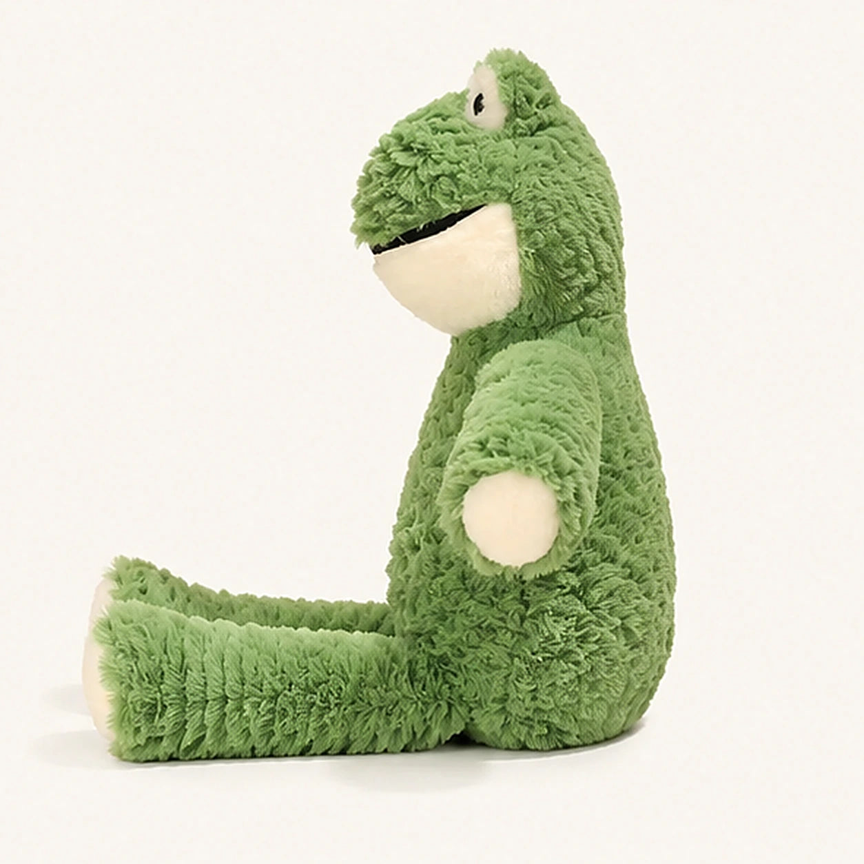 grenouille en peluche verte vue de profil