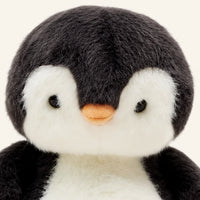 peluche pingouin gros plan visage