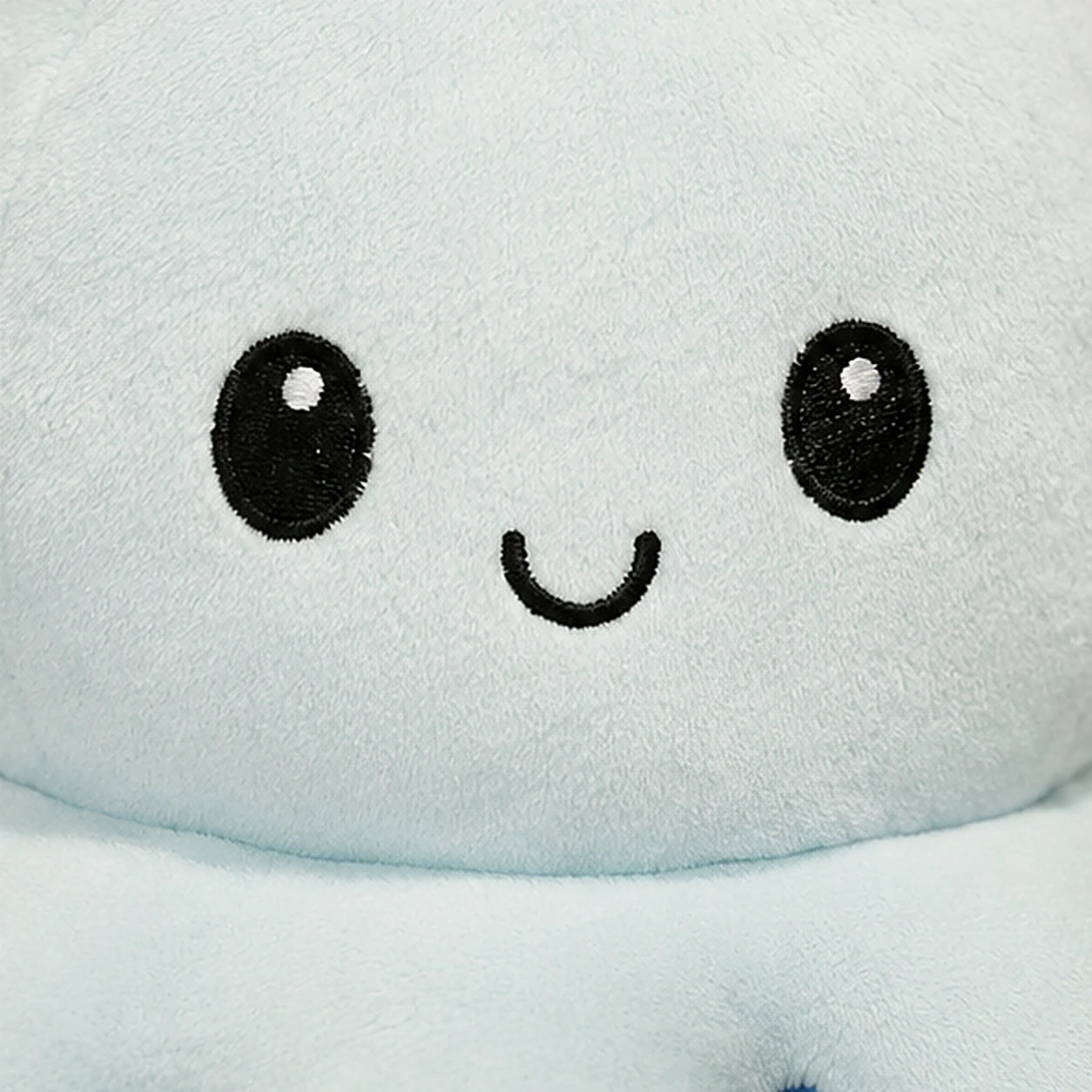 Peluche poulpe reversible detail texture
